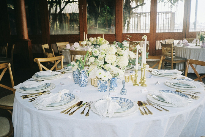 white flowers on clear glass vase on table